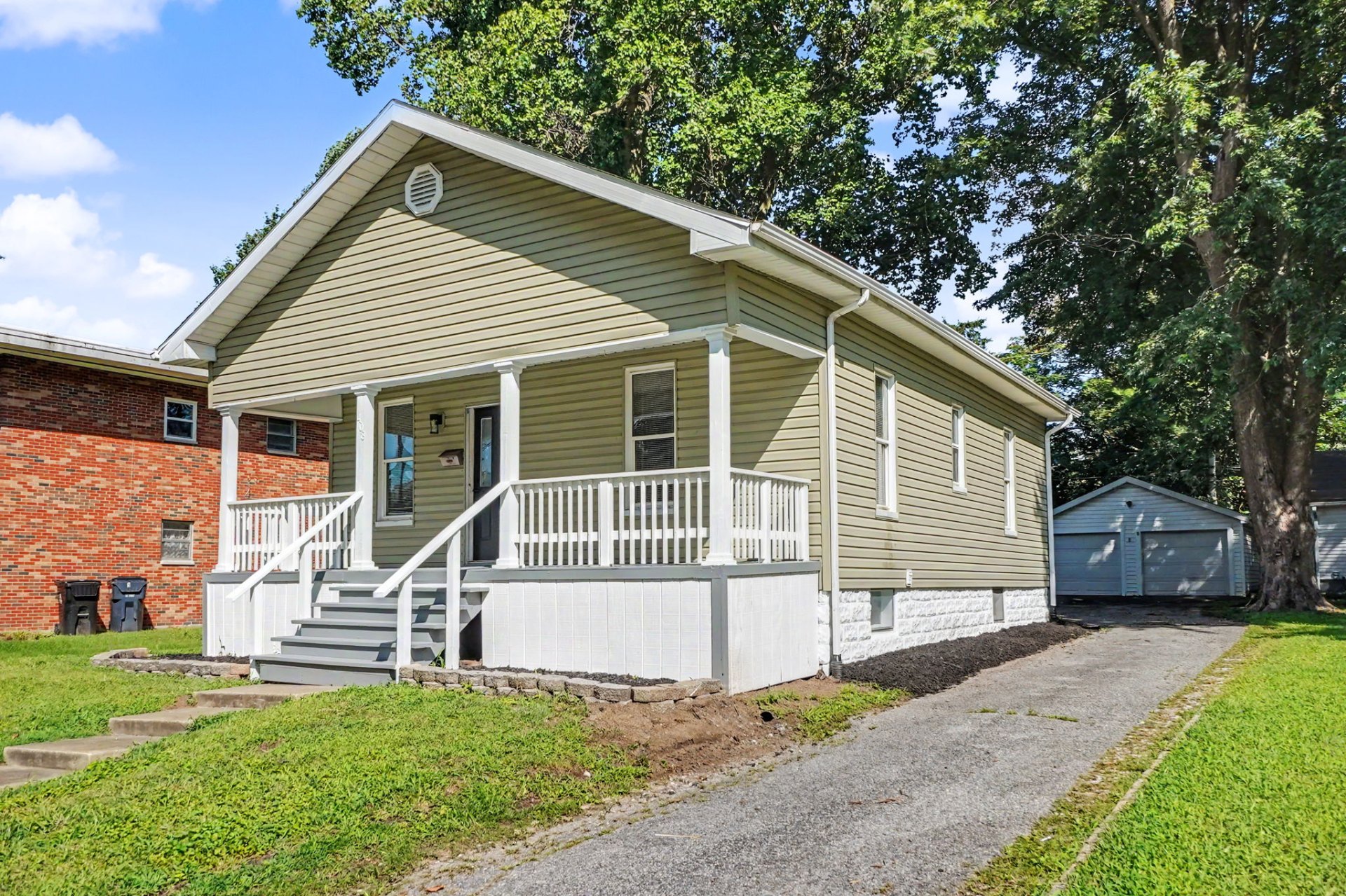 Belleville home, exterior view with driveway to detached garage