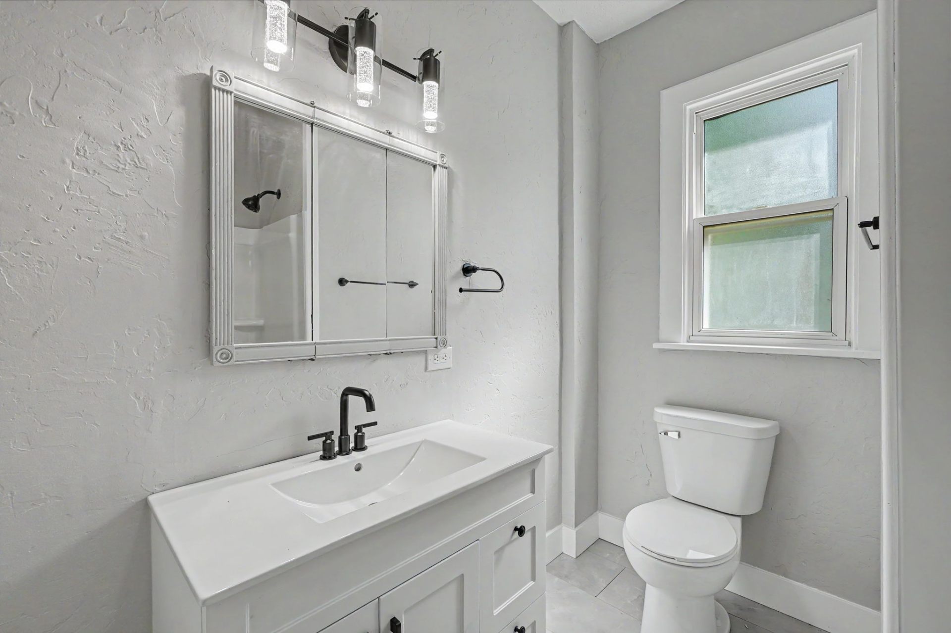 Belleville home, updated full bathroom with vanity and window