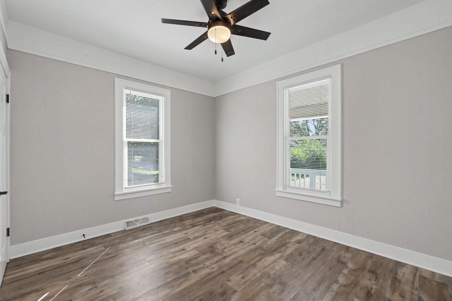 Belleville home, bright bedroom with two windows